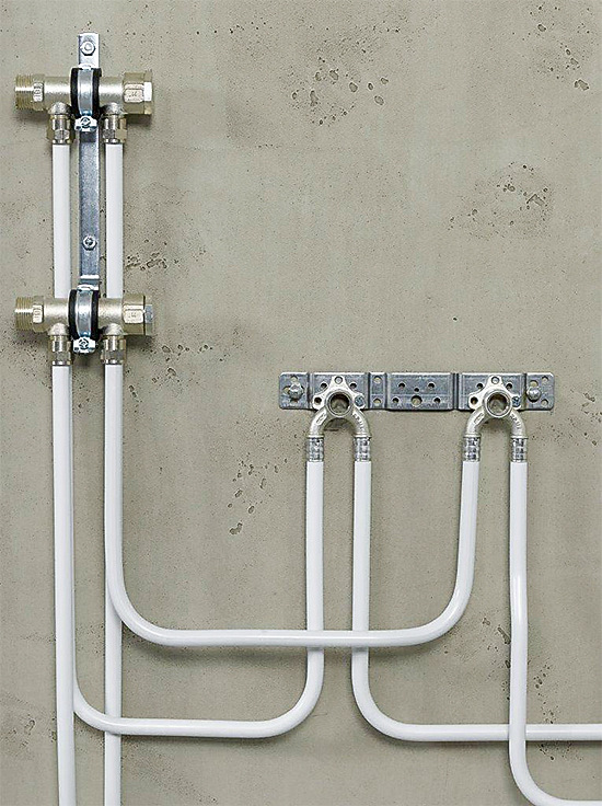 Bild 2: Doppel-Wandscheiben ermöglichen in Reihen- und Ringinstallationen das Durchschleifen der Trinkwasserleitung ohne Stagnationsstrecke